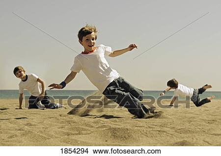 Picture - Playing in the sand. Fotosearch
