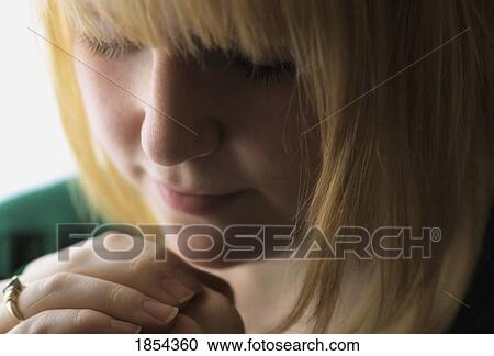 Stock Image - Praying. Fotosearch