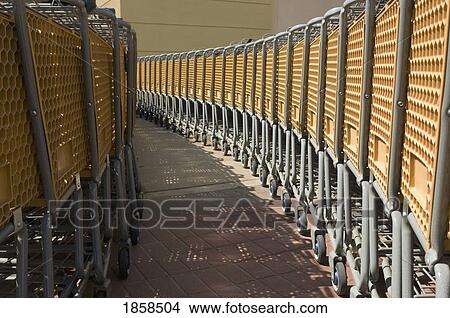 Rows of shopping carts View Large Photo Image Picture - Rows of shopping carts. Fotosearch