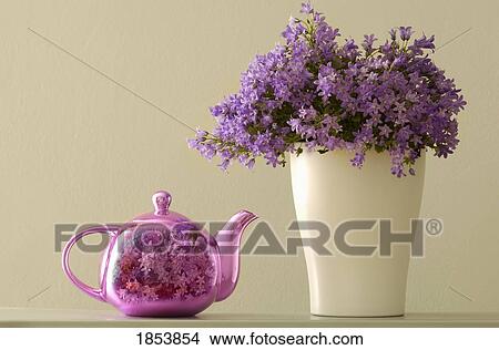 Picture - Teapot and flowers in a vase. Fotosearch