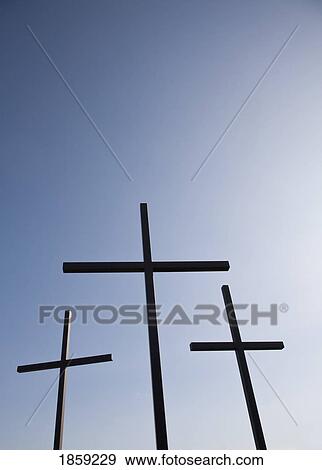 Stock Photo - Three crosses against blue sky. Fotosearch