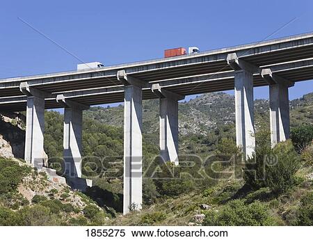Stock Photography - Trucks crossing bridge over ravine, Costa del Sol, Malaga Province, Spain. Fotosearch