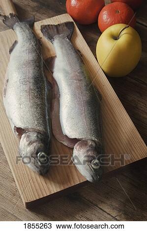 Two rainbow trout on a wooden platter View Large Photo Image Stock Image - Two rainbow trout on a wooden platter. Fotosearch