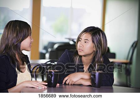 Stock Photo - Two teenage friends talking. Fotosearch