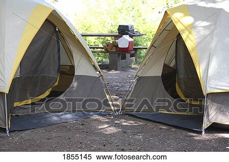 Two tents on a campsite View Large Photo Image Stock Photography - Two tents on a campsite. Fotosearch