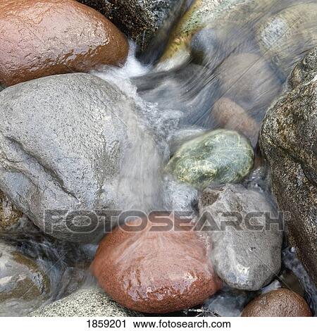 Stock Image - Water over rocks; Whistler, British Columbia, Canada. Fotosearch