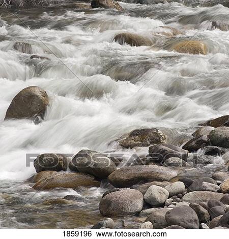 Stock Photograph - Water over rocks; Whistler, British Columbia, Canada. Fotosearch