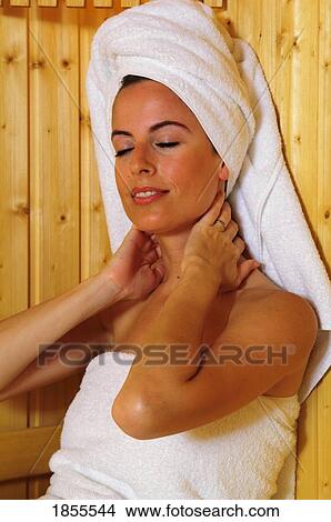 Picture - Woman enjoying the sauna. Fotosearch