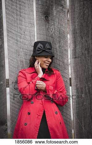 Stock Photograph - Woman in red coat. Fotosearch