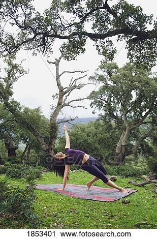 Stock Image - Woman stretching outside. Fotosearch