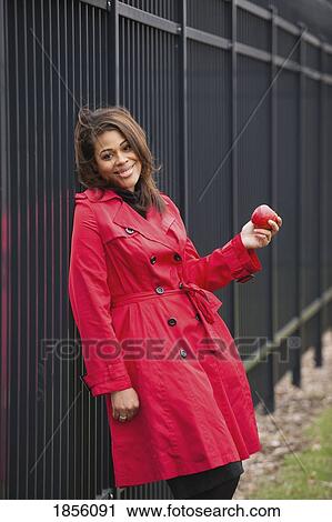 Woman with an apple View Large Photo Image Stock Image - Woman with an apple. Fotosearch