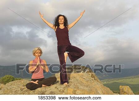 Women doing meditation View Large Photo Image Stock Photo - Women doing meditation. Fotosearch