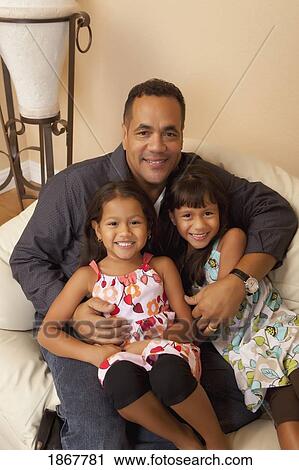 Stock Image - Father and daughters. Fotosearch