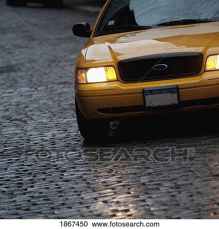 Stock Image - Front of a yellow vehicle. Fotosearch