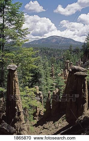 Stock Image - Hoodoos formed by erosion around rocks form foreground for Redondo Peak, New Mexico, USA. Fotosearch