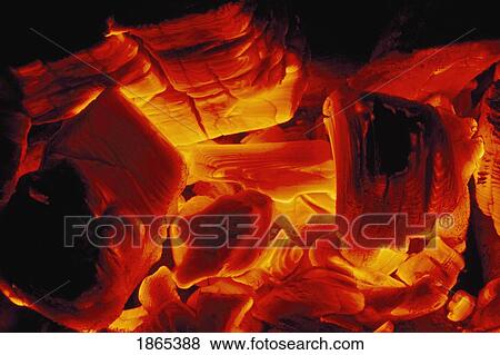 Stock Photo - Hot coals from wood fire glow yellow to red to orange. Fotosearch