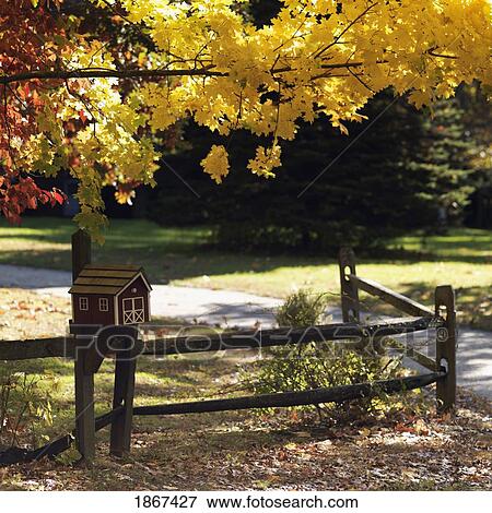 Stock Photo - House-shaped mailbox in autumn, Sag Harbor, New York, USA. Fotosearch