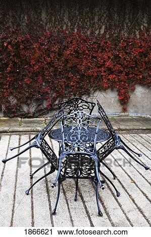 Stock Image - Iron table and chairs, Northumberland, England. Fotosearch