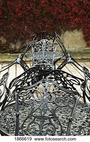Stock Photo - Iron table and chairs. Fotosearch