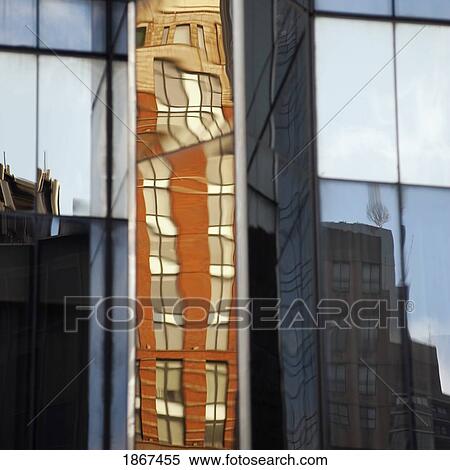 Stock Photography - Mirrored building with reflection of another building. Fotosearch