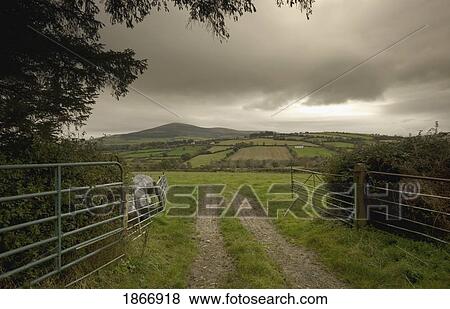 Stock Photo - Road through a gate. Fotosearch