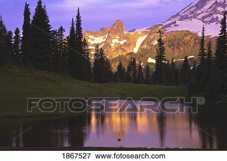 Stock Photo - Sunrise on mountain and mountain lake. Fotosearch