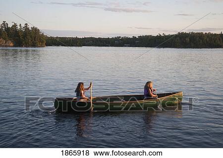 Two people in a canoe, Lake of the Woods, Ontario, Canada View Large Photo Image Stock Photo - Two people in a canoe, Lake of the Woods, Ontario, Canada. Fotosearch