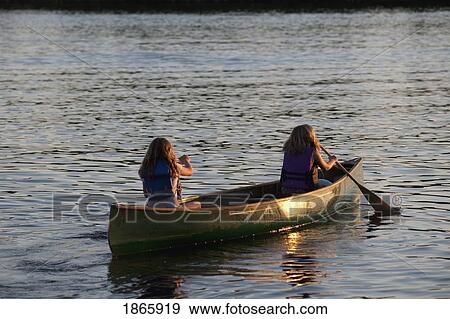 Two people in a canoe, Lake of the Woods, Ontario, Canada View Large Photo Image Stock Photo - Two people in a canoe, Lake of the Woods, Ontario, Canada. Fotosearch
