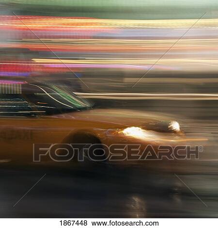 Yellow taxi traveling with speed View Large Photo Image Stock Photo - Yellow taxi traveling with speed. Fotosearch