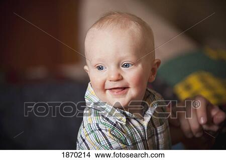 a baby boy with parent holding his hand View Large Photo Image Picture - a baby boy with parent holding his hand. Fotosearch