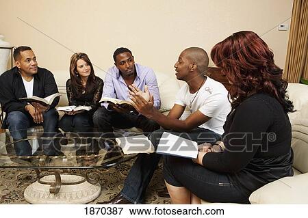 a group of adults in a home bible study View Large Photo Image Stock Photo - a group of adults in a home bible study. Fotosearch