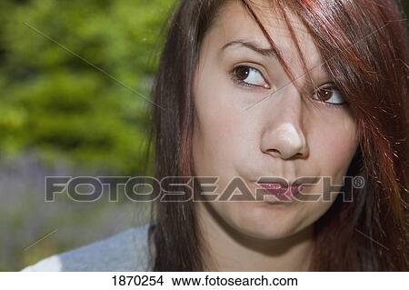 a teenage girl making a silly face View Large Photo Image Picture - a teenage girl making a silly face. Fotosearch