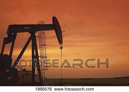 Alberta, Canada; Pumpjack at sunset View Large Photo Image Stock Photo - Alberta, Canada; Pumpjack at sunset. Fotosearch