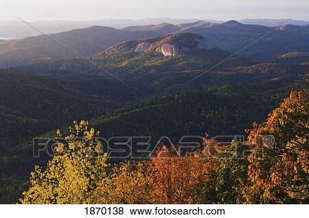 blue ridge parkway, north carolina, united states of america; autumn foliage frames a view of looking glass rock View Large Photo Image Stock Photo - blue ridge parkway, north carolina, united states of america; autumn foliage frames a view of looking glass rock. Fotosearch