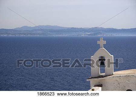 Church bell, cross and steeple with Sardinia, Italy in the background View Large Photo Image Stock Image - Church bell, cross and steeple with Sardinia, Italy in the background. Fotosearch