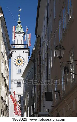 Stock Photography - clock tower from a street, salzburg, salzburger land, austria. Fotosearch