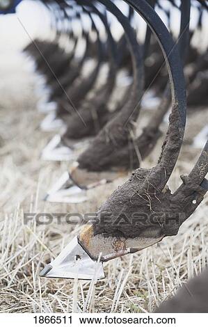 Stock Image - Close up of plowing blades. Fotosearch