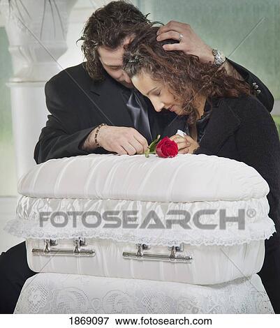 couple grieving at infant's coffin View Large Photo Image Stock Photo - couple grieving at infant's coffin. Fotosearch