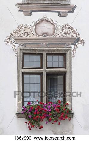 Stock Image - decorative window with a flower box, enns, austria. Fotosearch