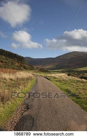 Stock Photo - elsdonburn, northumberland, england; road through the hills. Fotosearch