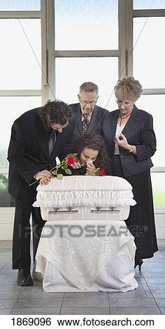 family grieving at an infant's coffin View Large Photo Image Stock Photograph - family grieving at an infant's coffin. Fotosearch