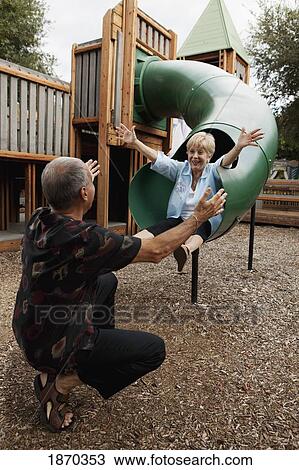 fort lauderdale, florida, united states of america; a couple playing at a playground View Large Photo Image Stock Image - fort lauderdale, florida, united states of america; a couple playing at a playground. Fotosearch