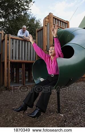 fort lauderdale, florida, united states of america; a couple playing at a playground View Large Photo Image Stock Photo - fort lauderdale, florida, united states of america; a couple playing at a playground. Fotosearch