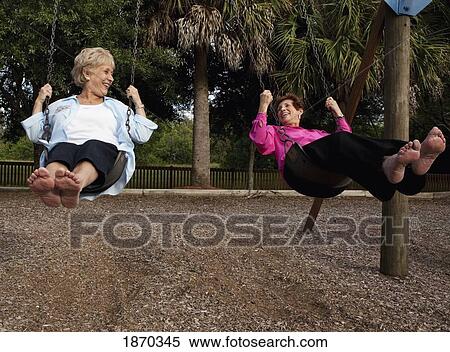 fort lauderdale, florida, united states of america; two women on the swings View Large Photo Image Stock Photography - fort lauderdale, florida, united states of america; two women on the swings. Fotosearch