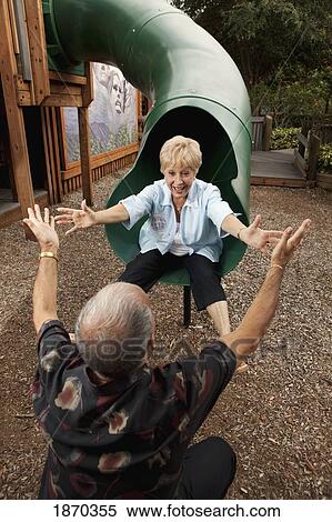 fort lauderdale, florida, united states of america; a couple playing at a playground View Large Photo Image Stock Photography - fort lauderdale, florida, united states of america; a couple playing at a playground. Fotosearch