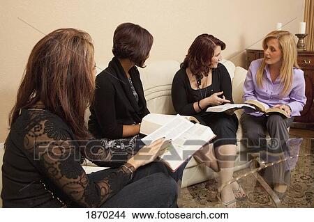 four women studying the bible View Large Photo Image Picture - four women studying the bible. Fotosearch