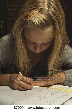Picture - girl doing homework. Fotosearch