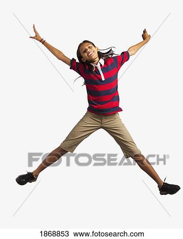Stock Image - girl jumping with arms and legs outstretched. Fotosearch