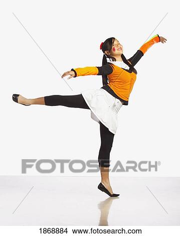 Picture - girl posing and balanced on one leg. Fotosearch