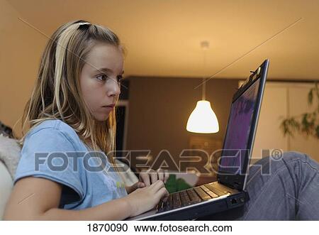 girl using a laptop computer View Large Photo Image Stock Image - girl using a laptop computer. Fotosearch